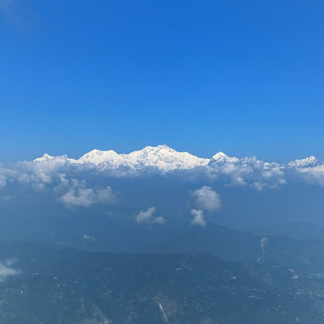 Aerial view of the snow-capped Himalayan peaks and clouds, home of Darjeeling Cup specialty teas